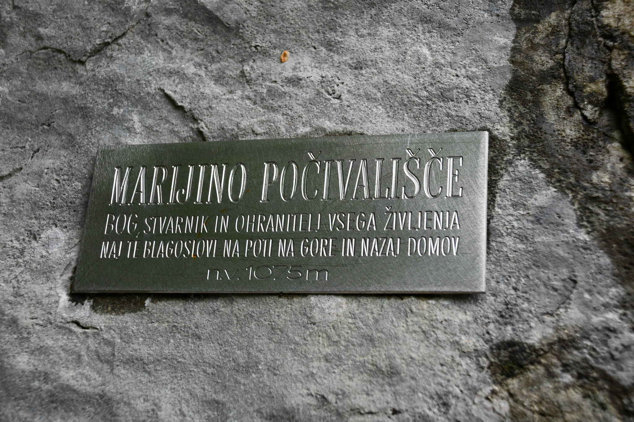 Memorial bench plaque just after tunnel